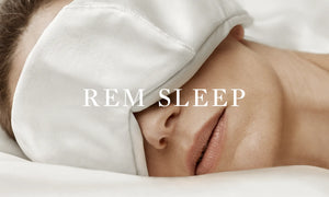 A woman with a Deepsilk Sleeping Mask experiencing peaceful REM sleep benefits from the restorative effects of this crucial sleep stage.