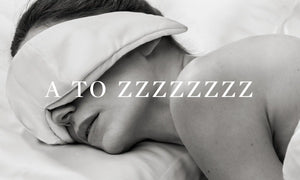 Woman sleeping in white silk wearing the OPSUNDBAY Deepsilk Sleeping mask - Know everything about the eyemask from A to Z